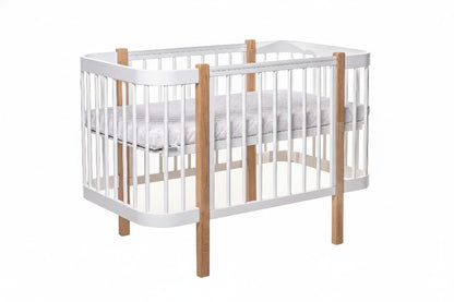 Bright and modern nursery room featuring the Elin natural wood baby crib