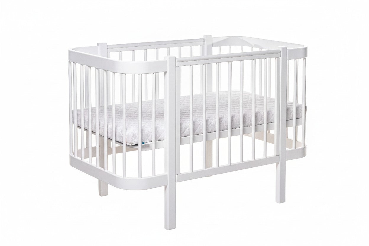 Front view of the all-white standard European nursery cot