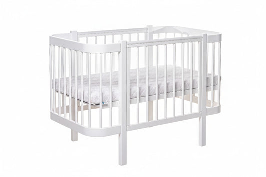 Safe sleep newborn mattress fitted perfectly inside the white KOTTO crib
