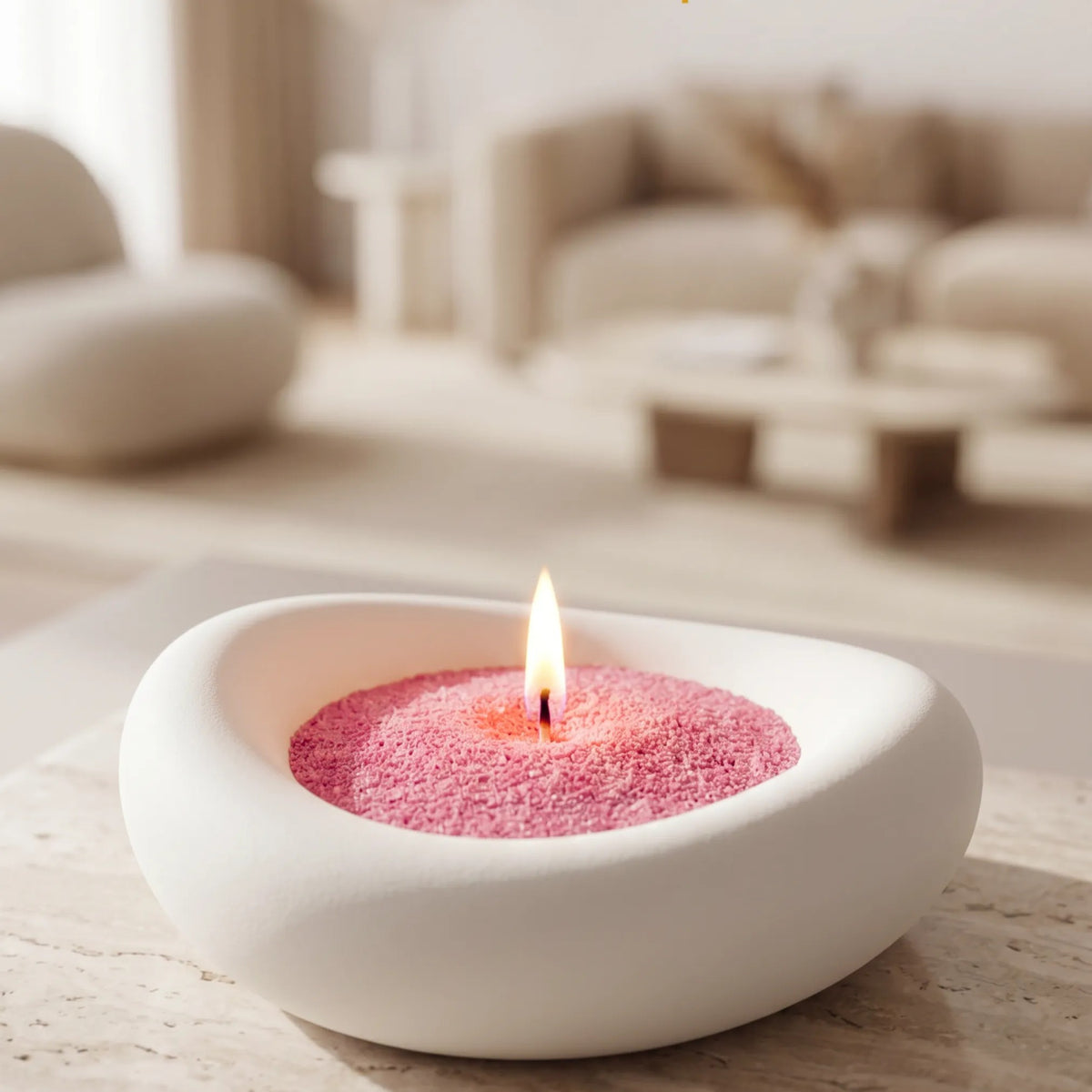 Lit Blush Vintage pearled sand candle - Close up of artistic vase in a elegant living room