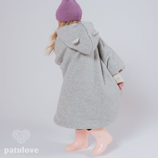 Lifestyle: child secured safely in car seat with poncho. - Bear