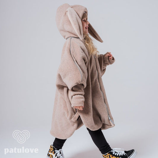 Lifestyle: child secured safely in car seat with poncho - Bunny