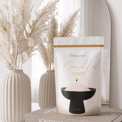 Candledust Champagne Rhubarb scented pearled candle sand in a 1kg resealable refill pouch near elegant vases