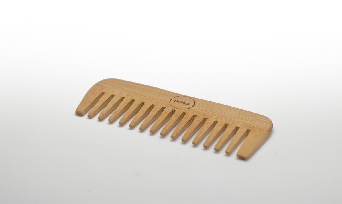 Front view of handcrafted lightweight bamboo hair comb for all hair types on a clean background