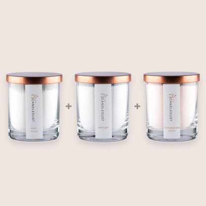 Candledust Cosy Discovery Trio set featuring three 160g scented glass candles in Dark Honey, Midnight, and Pomegranate Spice