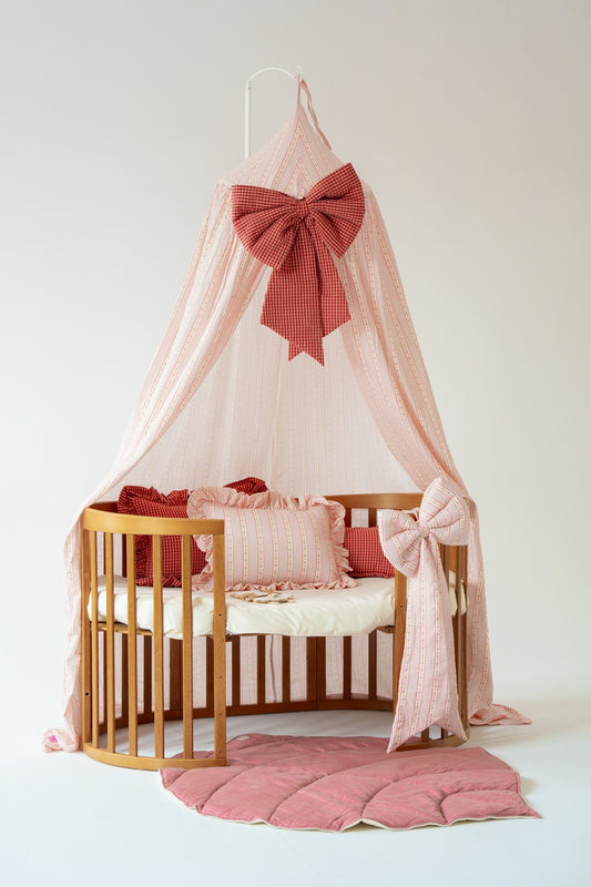 Rustic nursery decor featuring a plaid checkered canopy