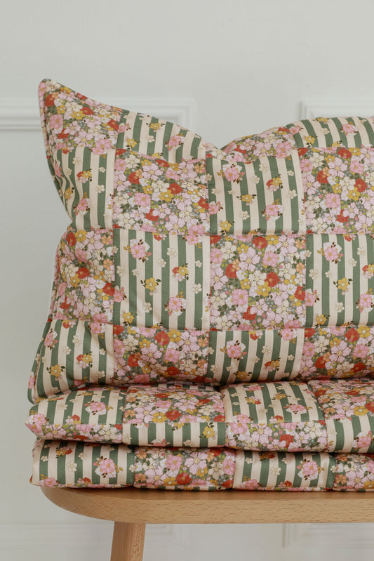 Detail of the Green Garden floral patchwork pattern and premium stitching