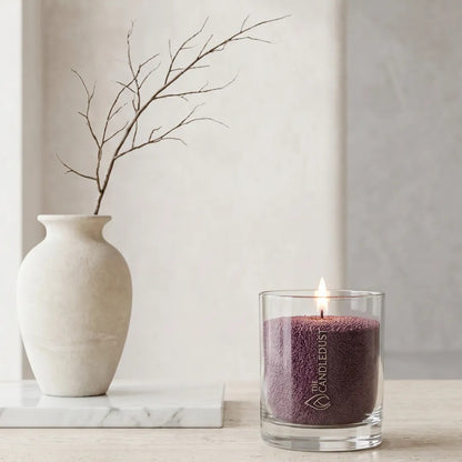 Modern minimalist interior styling featuring an unlit Dark Lilac unscented glass candle displayed near artistic vase
