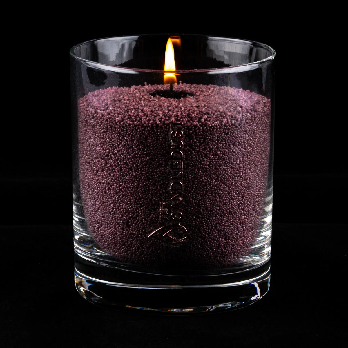 Candledust Dark Lilac unscented pearled candle in a 160g glass jar with cotton wick on a dark background