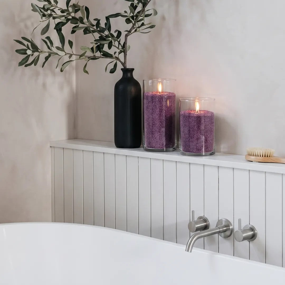 Cozy Bathroom atmosphere with a Dark Lilac pearled sand candle burning cleanly 
