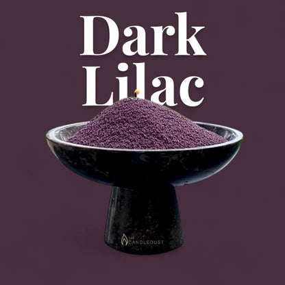 Dark Lilac text on a deep lilac background with a glass vase of unlit pearled candle sand in the foreground