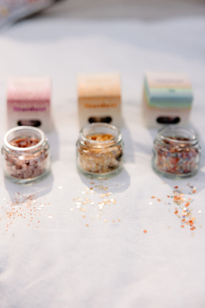 Detail of the glass jar packaging for Gold Star Dust glitter