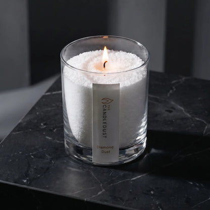 Modern minimalist interior styling featuring a lit Diamond Dust scented glass candle 