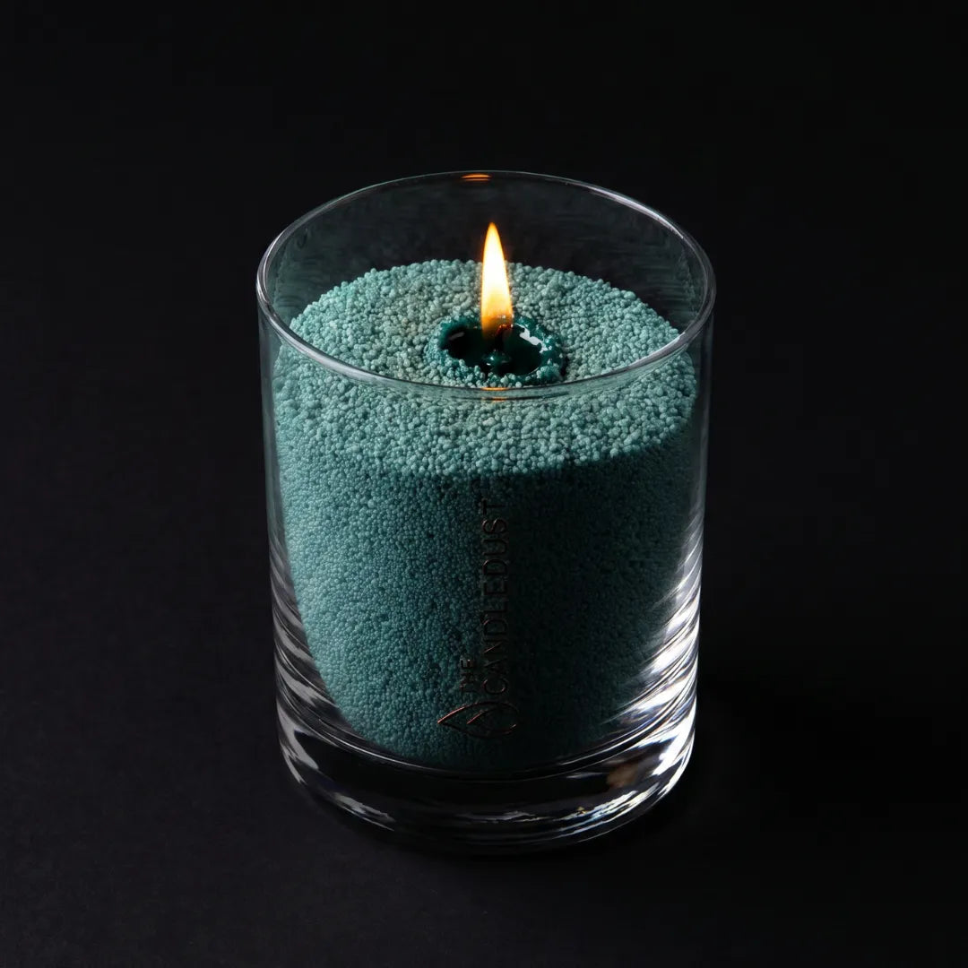 Candledust Emerald Green unscented pearled candle in a 160g glass jar on a back background