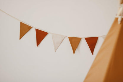 Ochre linen garland for warm-toned sustainable nursery decor