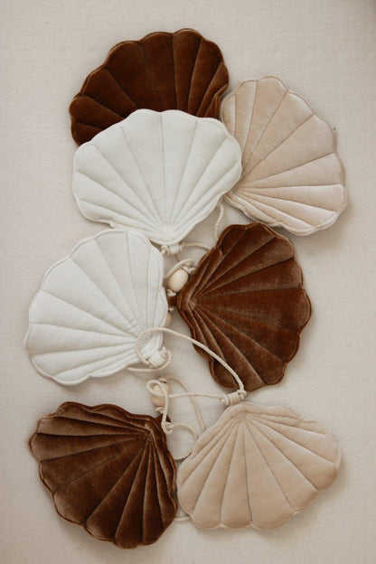 Front view Moi Mili Beige Pearl Shell Garland - Neutral hanging bunting with soft fabric discs