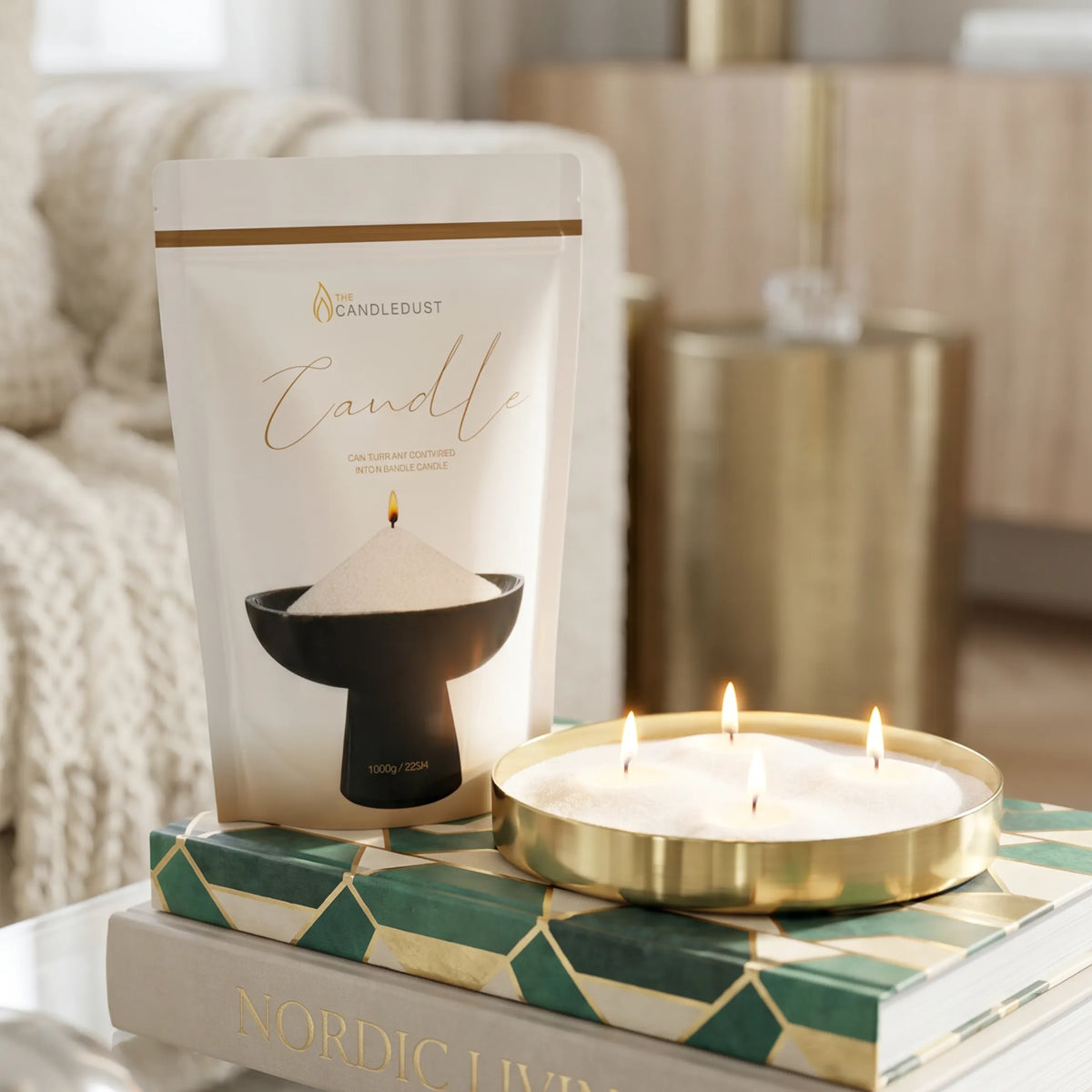 Lit Ivory pearled sand candle displayed on a decorative tray resting on stacked books