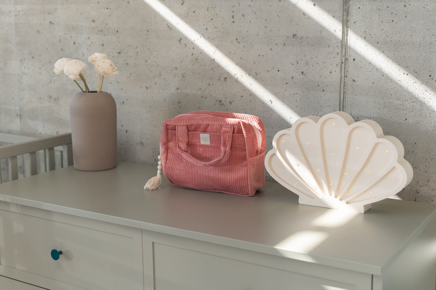 Moi Mili Large Make-Up Bag Coral - Vibrant cotton travel pouch on a chest of drawers