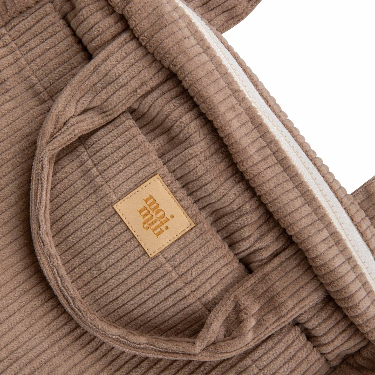 Close-up of the minimalist Latte cotton fabric and premium finish