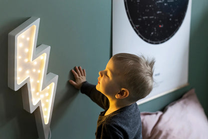 Little Lights Bolt Lamp on with child looking on  - Handmade wooden lightning bolt night light