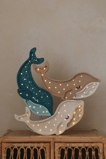 Wooden whale shaped night light for ocean themed nursery 3 colours