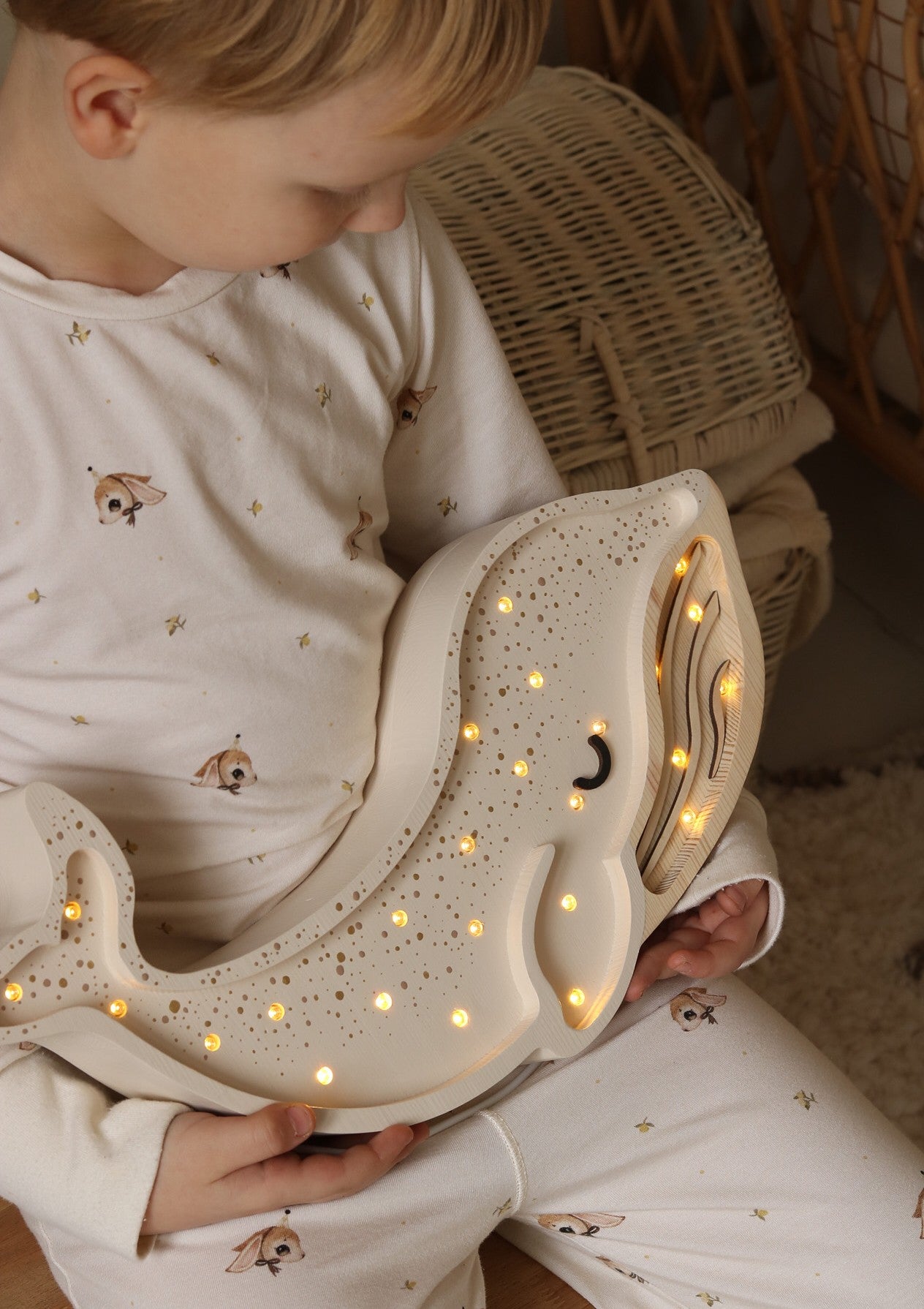 Kid with Handmade solid pine wood whale lamp with warm LED glow
