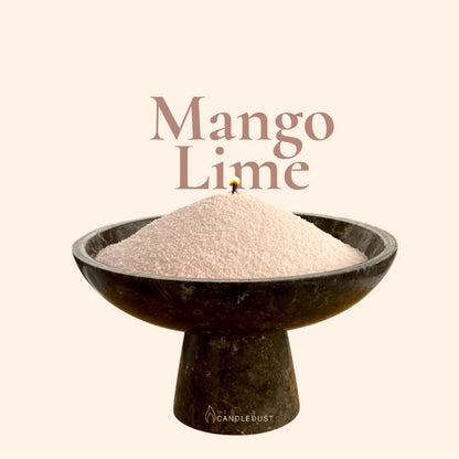 Mango Lime text on a matching vibrant tropical citrus background with a glass vase full of unlit pearled candle sand in the foreground