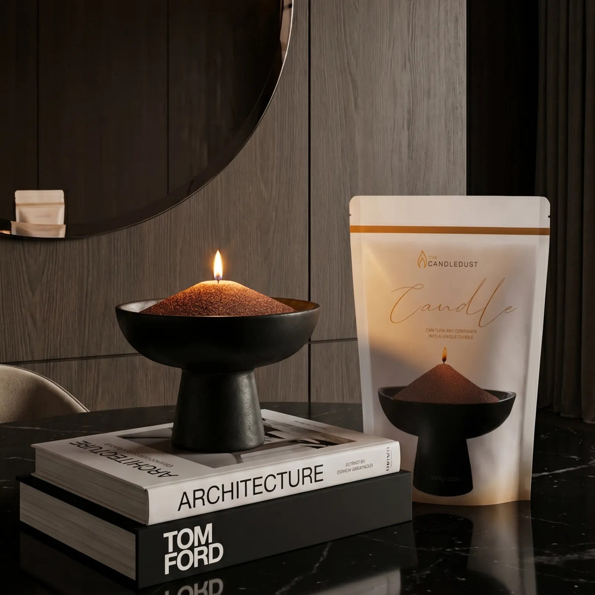Lit Mocha Mousse pearled sand candle displayed on a decorative vase resting on stacked books