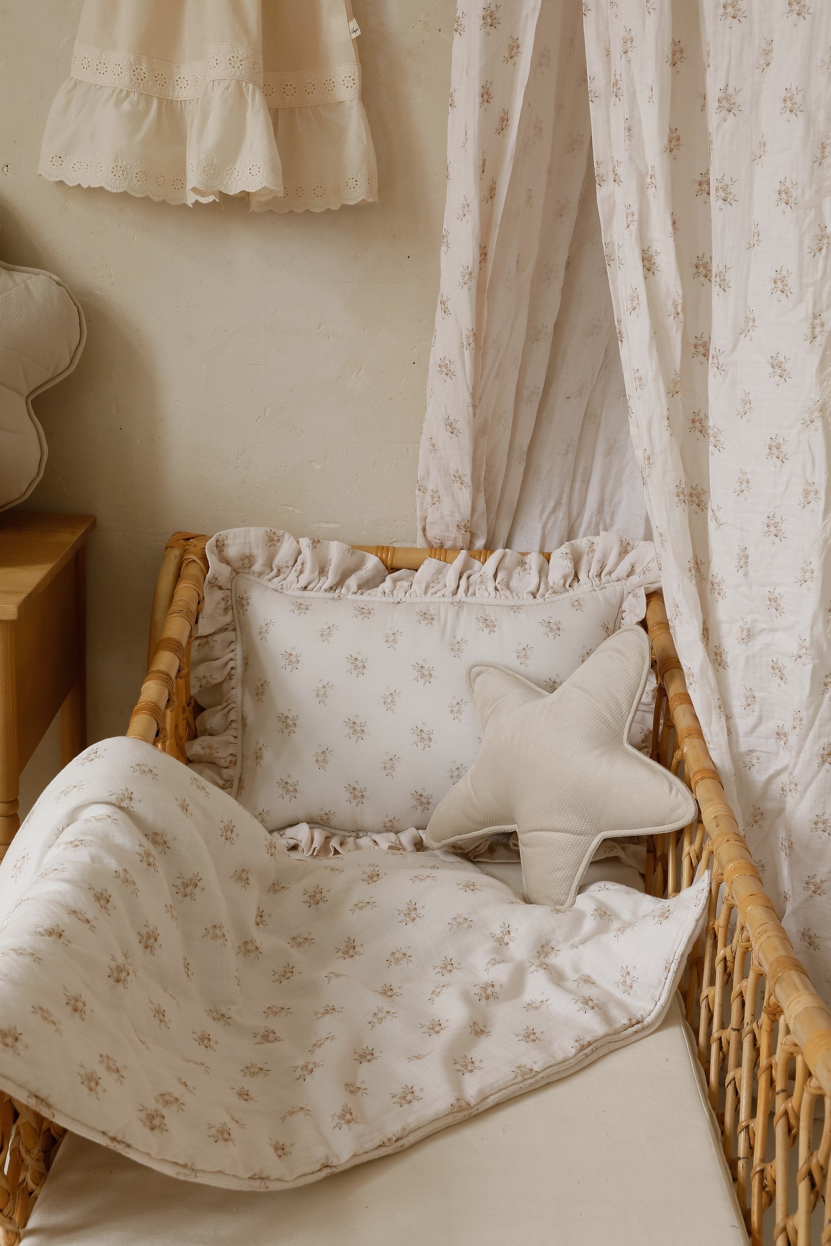 Nursery styling: Boho Flowers bedding set styled with rattan furniture