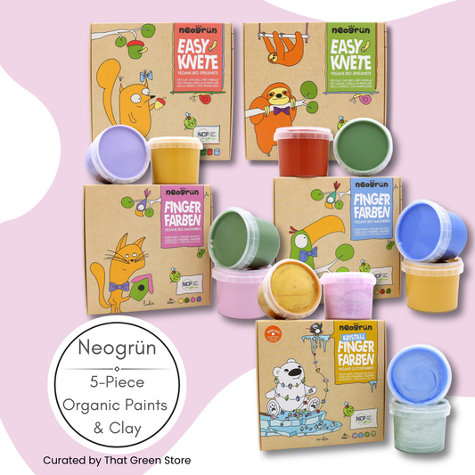 Five Neogrün Neosrun children's paint and clay kits arranged on a pastel pink background. The set includes illustrated kraft paper boxes and small plastic tubs of paint in multiple colors such as purple, yellow, green, orange, pink, and blue.