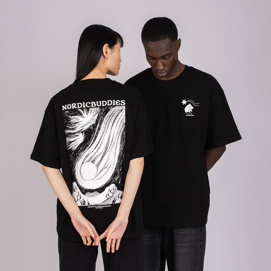Male and Female models wearing the unisex Moomin Novels Heavy T-Shirt Comet Black - Edgy Scandi style.