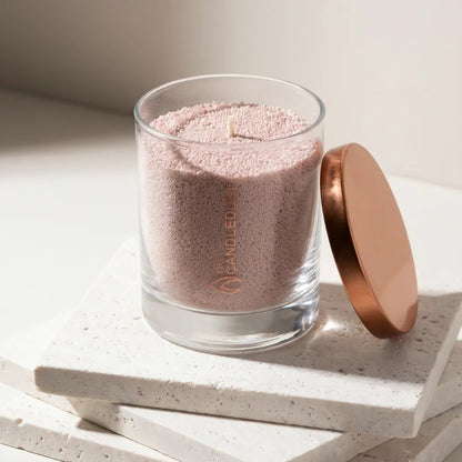 Modern minimalist interior styling featuring an unlit Nude unscented glass candle displayed on a tile