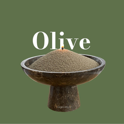 Olive Green text on a matching earthy olive green background with a glass vase full of unlit pearled candle sand in the foreground