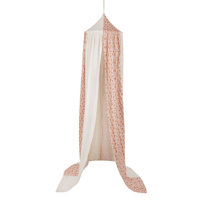 Botanical themed nursery decor featuring a flower play canopy