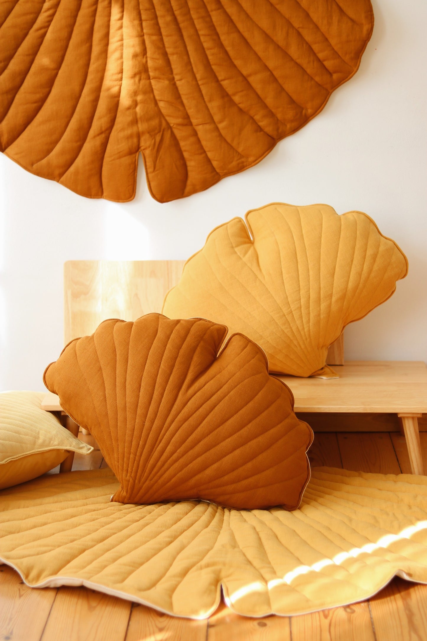 Nursery decor: Caramel ginkgo leaf playmat styled in a warm, nature-themed room