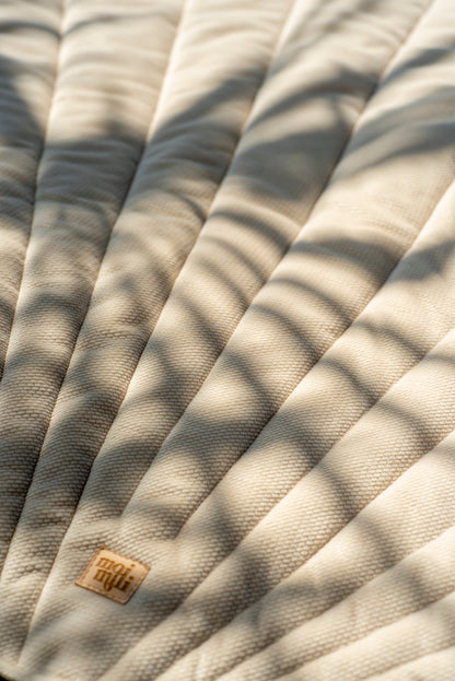 Detailed quilting and vein stitching on the luxurious beige velvet shell mat