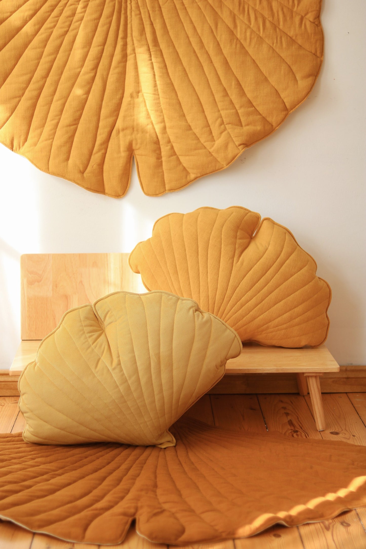 Boho nursery: Mango linen leaf mat on a natural wood floor 