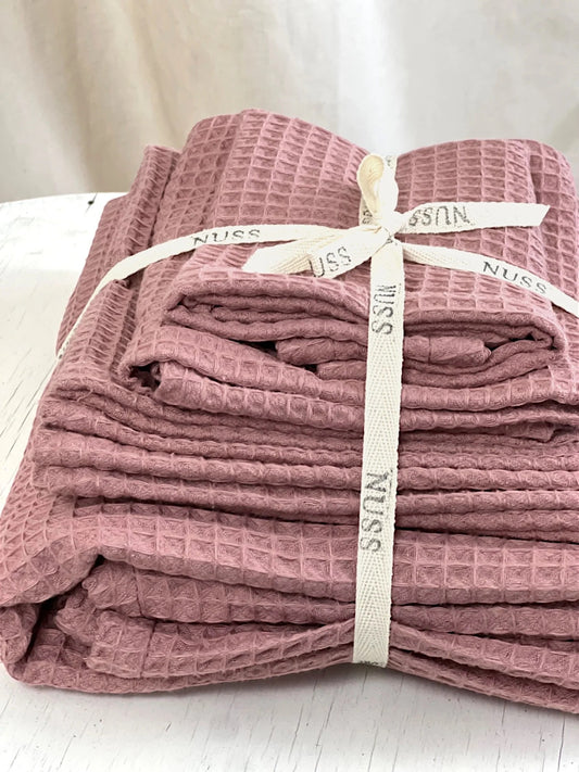 Old Pink Organic Waffle Towel Bundle Tied with Ribbon on Table | NUSS