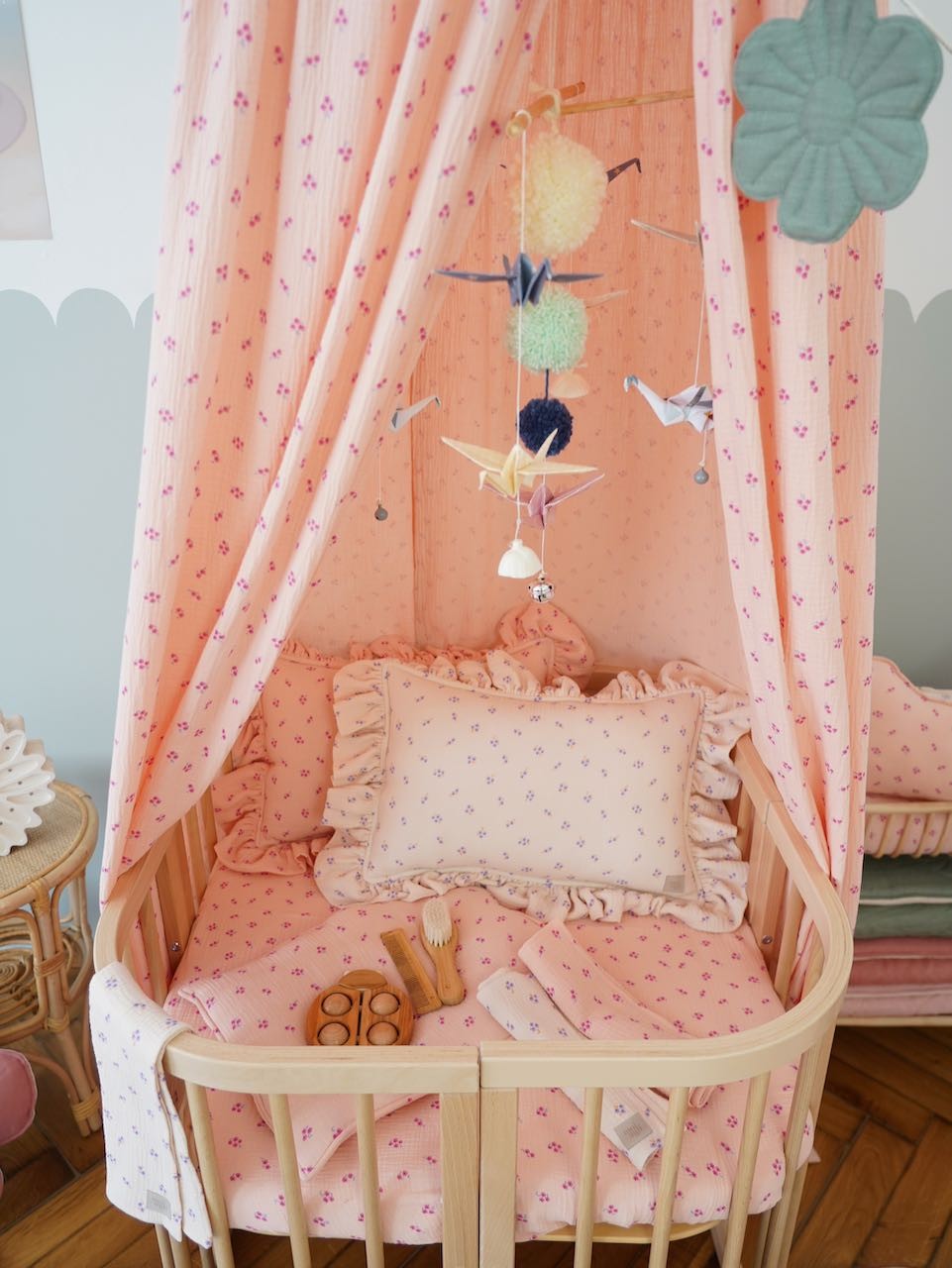Multi-colored pastel nursery mobile featuring delicate hanging elements and sturdy frame
