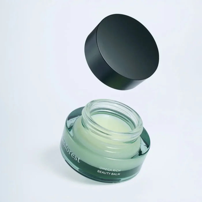 Usva rainforest omega rich balm with opened lid on a white background