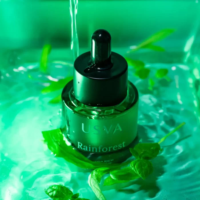 USVA Rainforest Omega Rich Oil Serum on a green water background