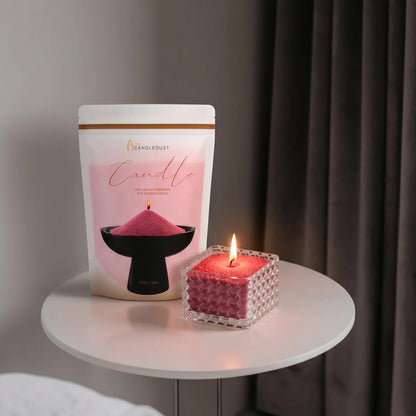 Elegant Glass vase filled with Red pearled candle sand and lit cotton wicks resting on a small round table
