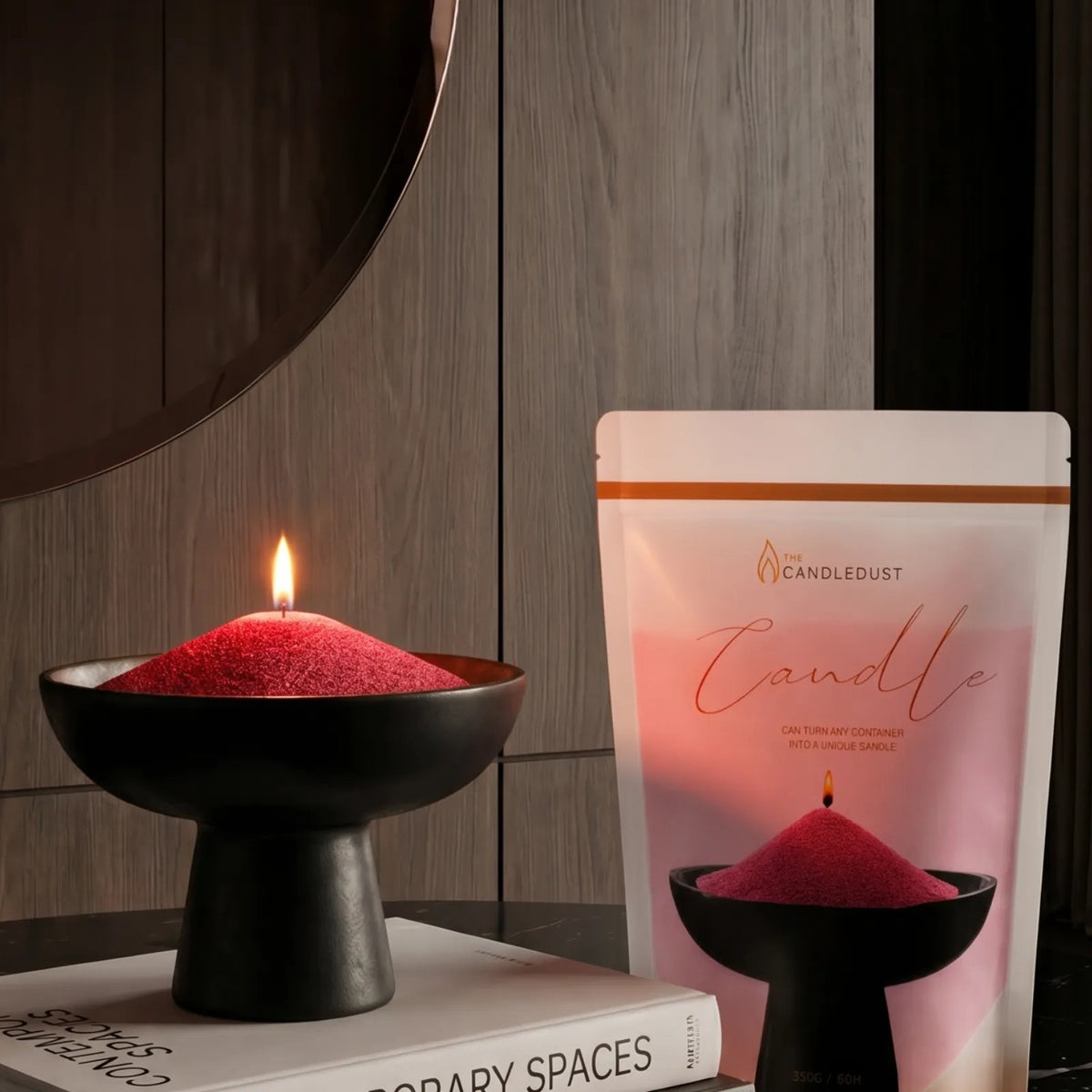Lit Red pearled sand candle displayed on an elegant vase resting on stacked books