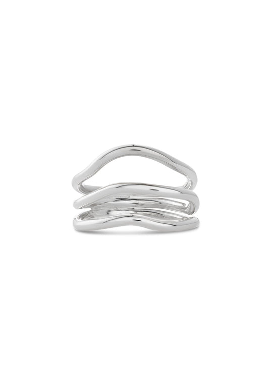 Close-up of the handcrafted silver Reef Break Wave Ring on a white background.