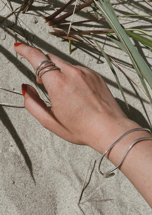 Model wearing at the beach Reef Break Wave Ring - Silver 