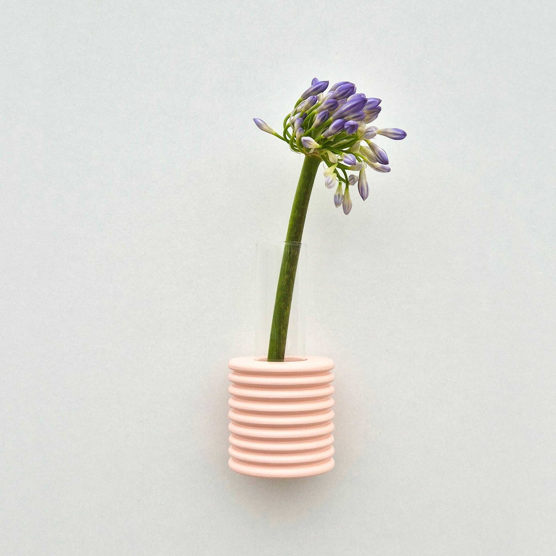 Modern Ribble wall-mounted ceramic vase in Pink, handmade in Portugal. Space-saving vertical garden decor with Carbon-Neutral Shipping.