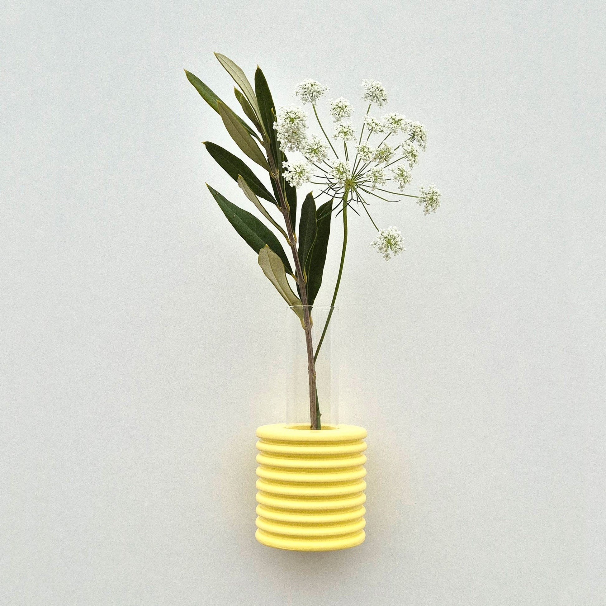 Modern Ribble wall-mounted ceramic vase in Yellow, handmade in Portugal. Space-saving vertical garden decor with Carbon-Neutral Shipping.