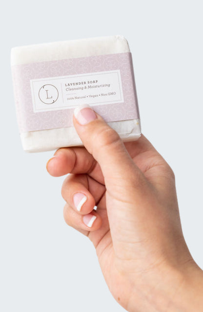 Close up of Lavender Handmade Soap Bars - Woman's hand holding natural handmade soap bar | Lizush