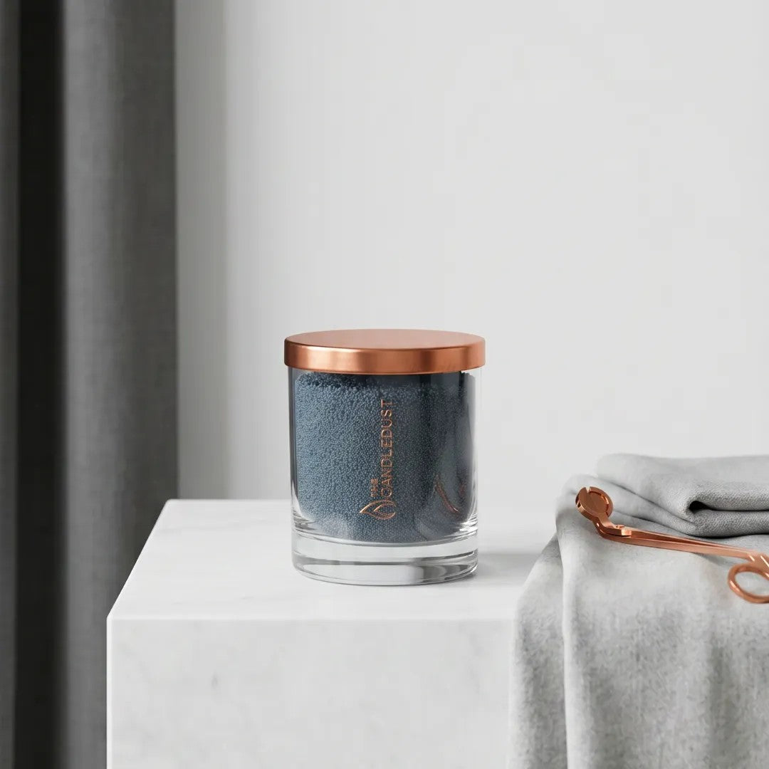 Candledust Space Grey unscented pearled candle in a 160g glass jar sitting on a white marble countertop