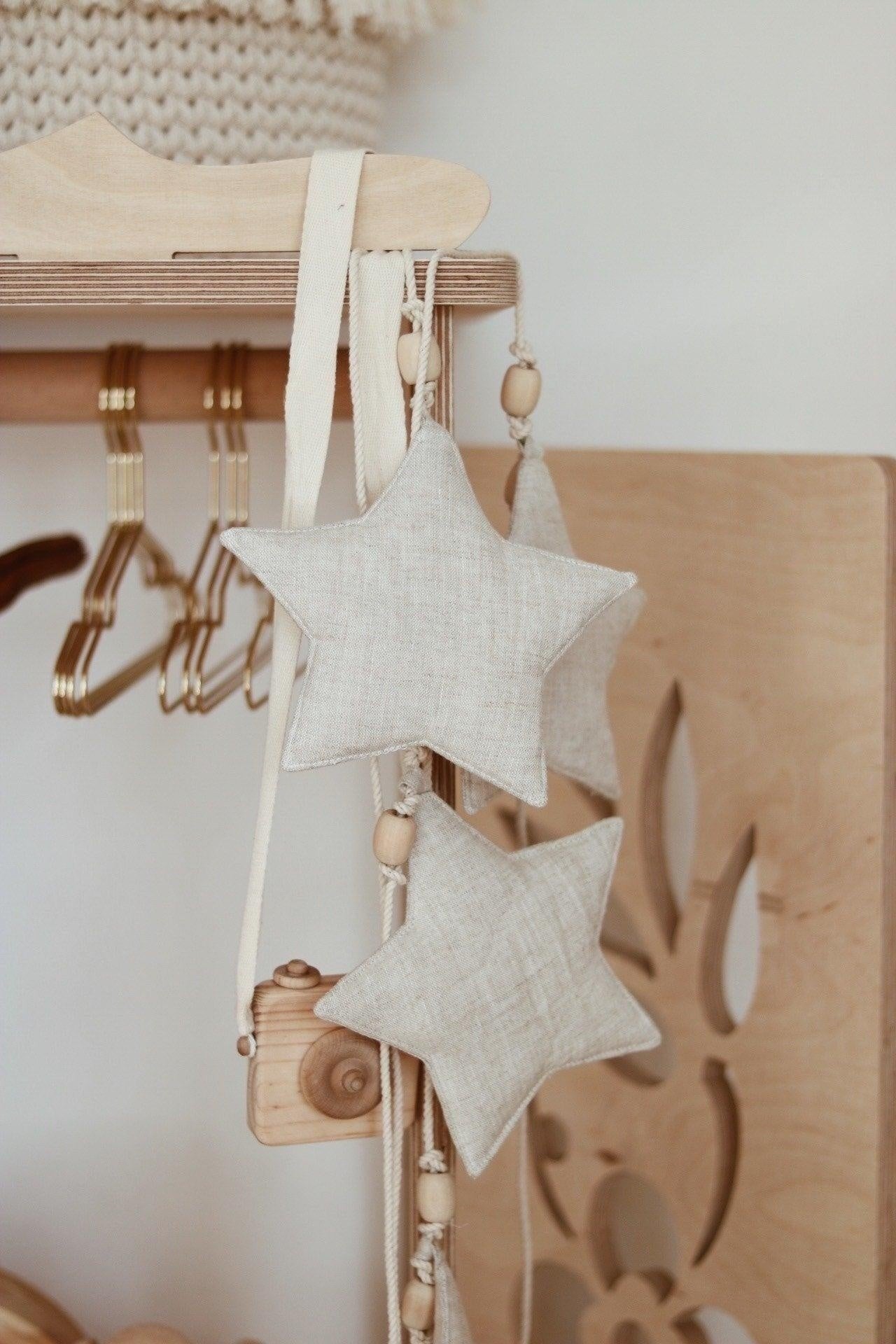 Moi Mili Sand Star Dust Star Garland - Warm beige hanging bunting with subtle shimmer hanging on a shelf